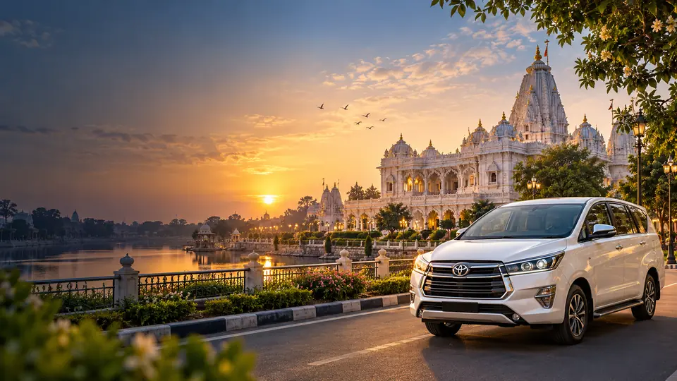 White Innova Crysta on the road beside Prem Mandir in Vrindavan at sunset